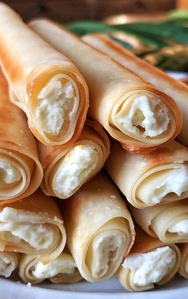 CRAB RANGOON EGG ROLLS fried to golden perfection and are the ultimate party appetizer